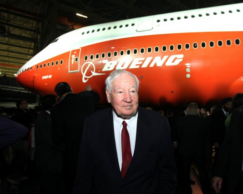 Joe Sutter, Boeing's chief engineer on the original jumbo, and known as the "father of the 747." walks in front of a newly unveiled 747-8 jumbo passenger jet at the company's Everett, Washington commercial airplane manufacturing facility, February 13, 2011. REUTERS/Anthony Bolante